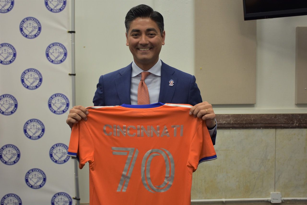 Mayor Aftab Pureval poses with an FC Cincinnati jersey given to him by the club. (Provided: City of Cincinnati)