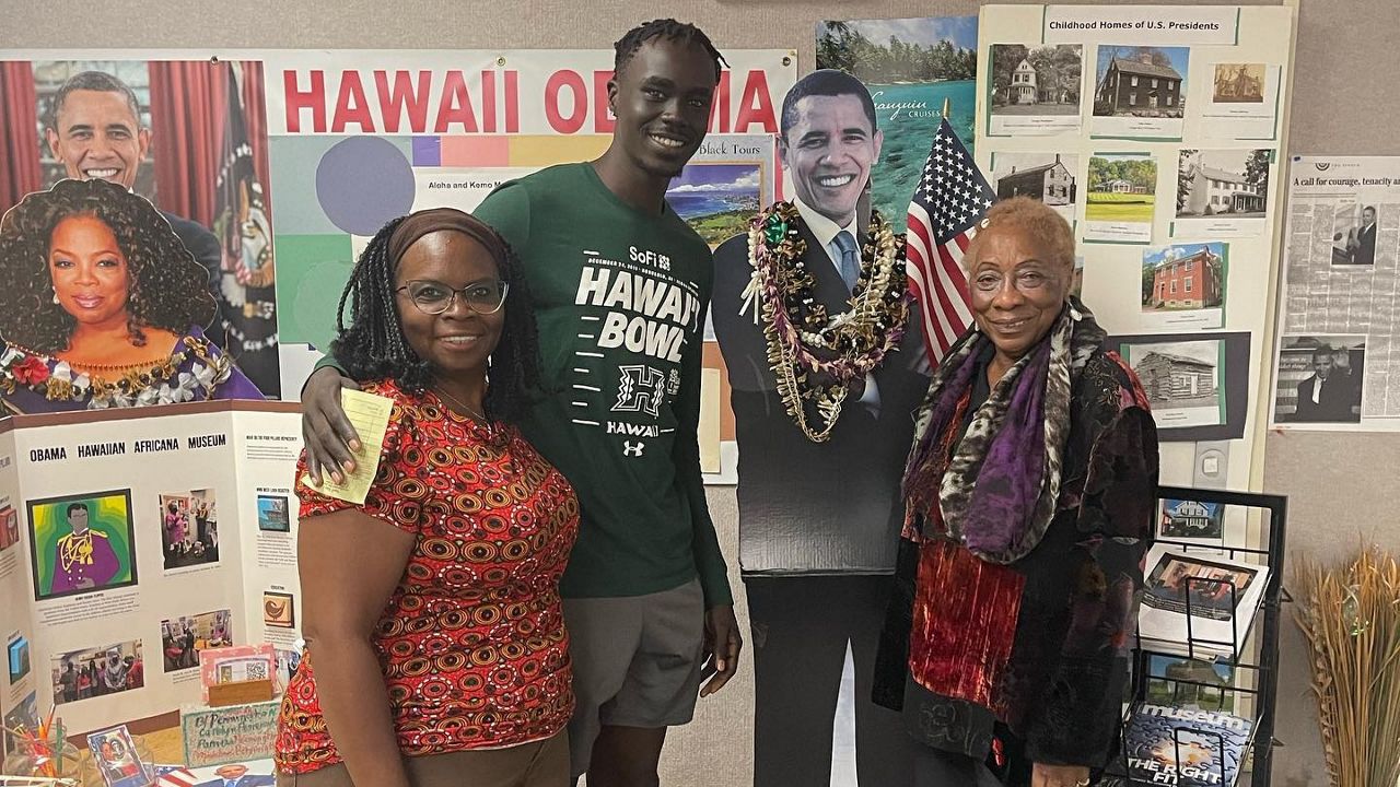 Museum Founder Deloris Guttman (right) poses with visitors at the Obama Hawaiian Africana Museum. (Photo courtesy of Obama Hawaiian Africana Museum)