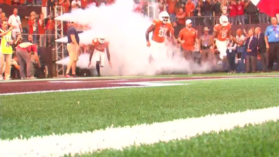 University of Texas football players running through tunnel before a game (Spectrum News/File)