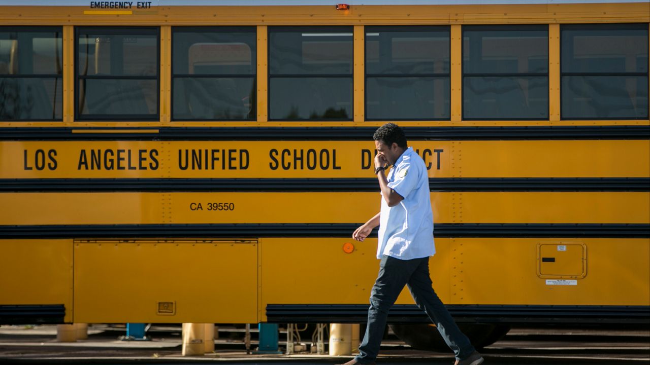 Los Angeles Unified School District bus in Gardena, Calif. (AP Photo/Damian Dovarganes)