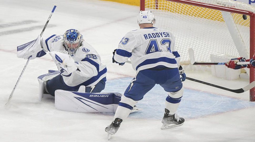 Tampa Bay Lightning goaltender Andrei Vasilevskiy gives up a goal to Montreal Canadiens' Mike Matheson as Lightning's Darren Raddysh watches during the second period of an NHL hockey game Tuesday, March 21, 2023, in Montreal. (Graham Hughes/The Canadian Press via AP)