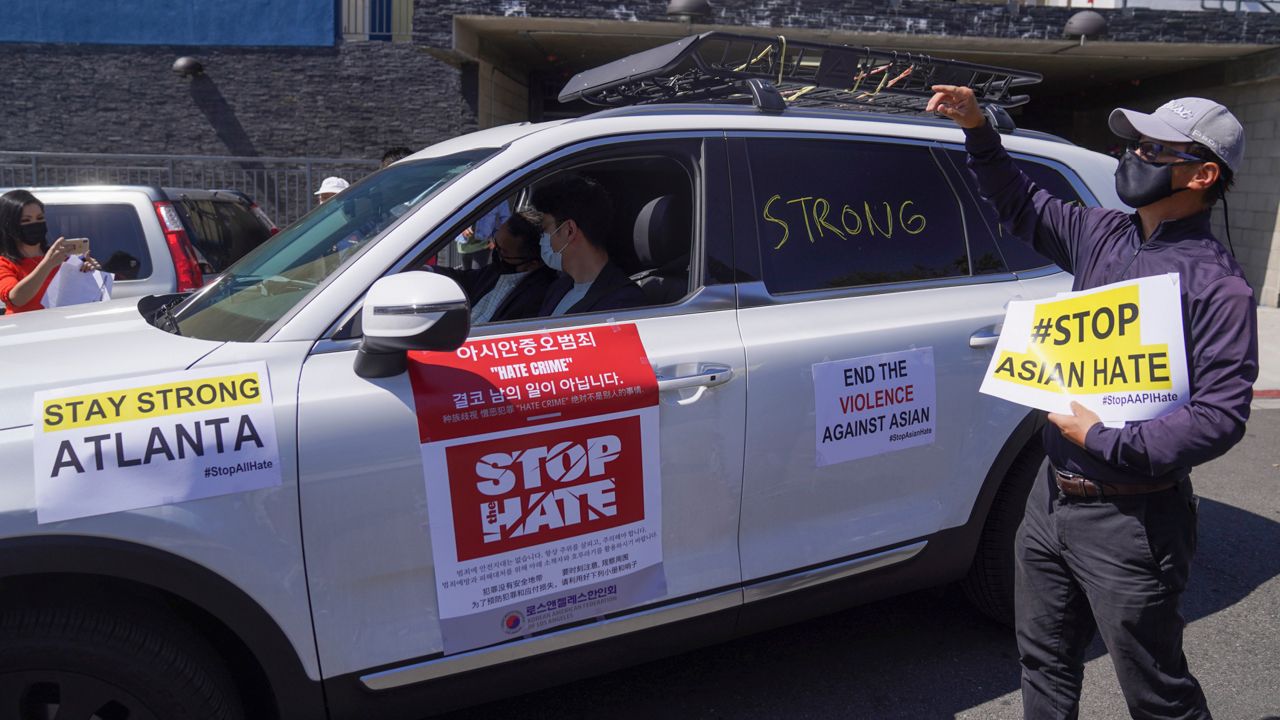 Members of the Korean American Federation of Los Angeles drive in a caravan around Koreatown to denounce hate against the Asian American and Pacific Islander communities on March 19, 2021. (AP Photo/Damian Dovarganes)