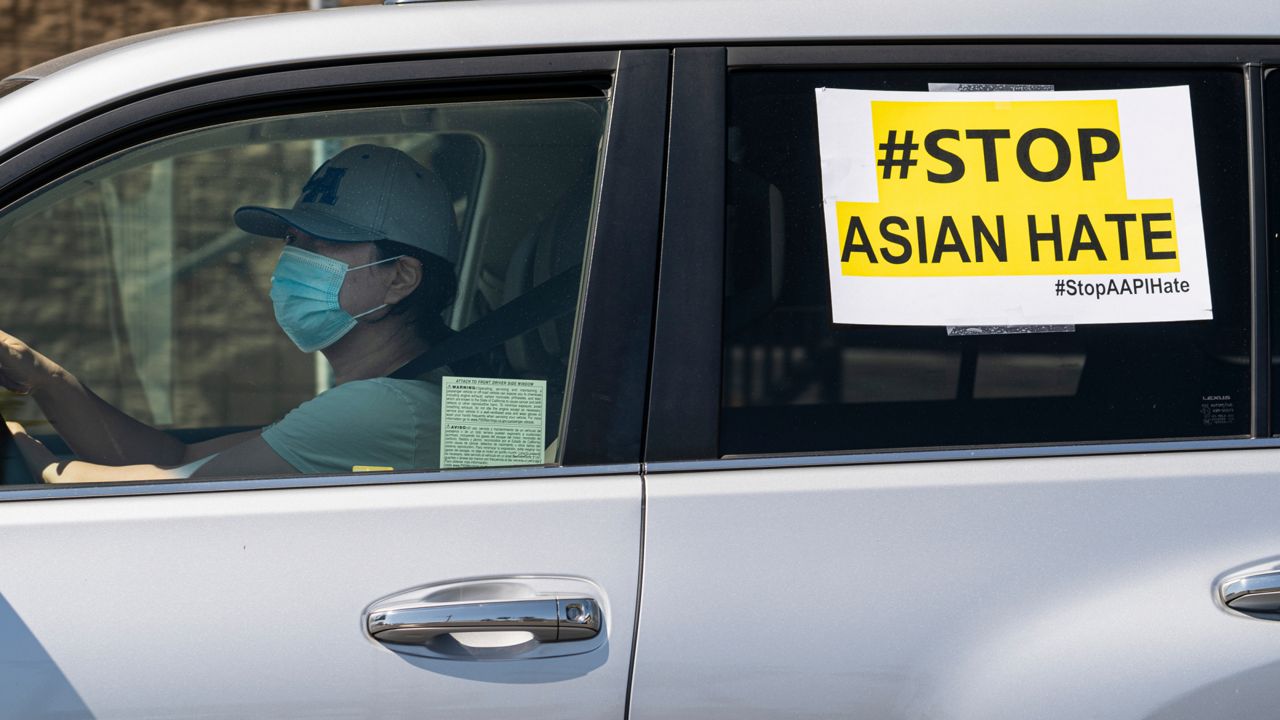 #StopAsianHate sign seen in a caravan around Koreatown to denounce hate against the Asian American and Pacific Islander communities  on March 19, 2021. (AP Photo/Damian Dovarganes)