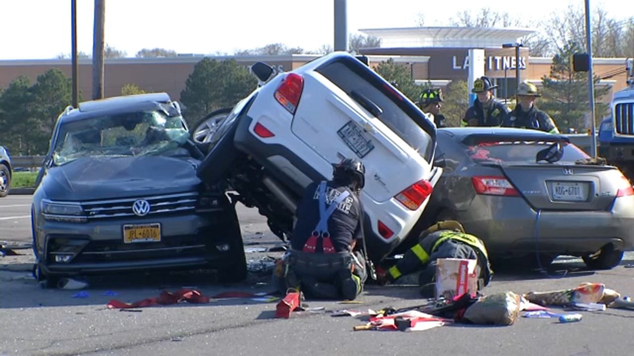 A photo of firefighters responding to a three-car crash. 