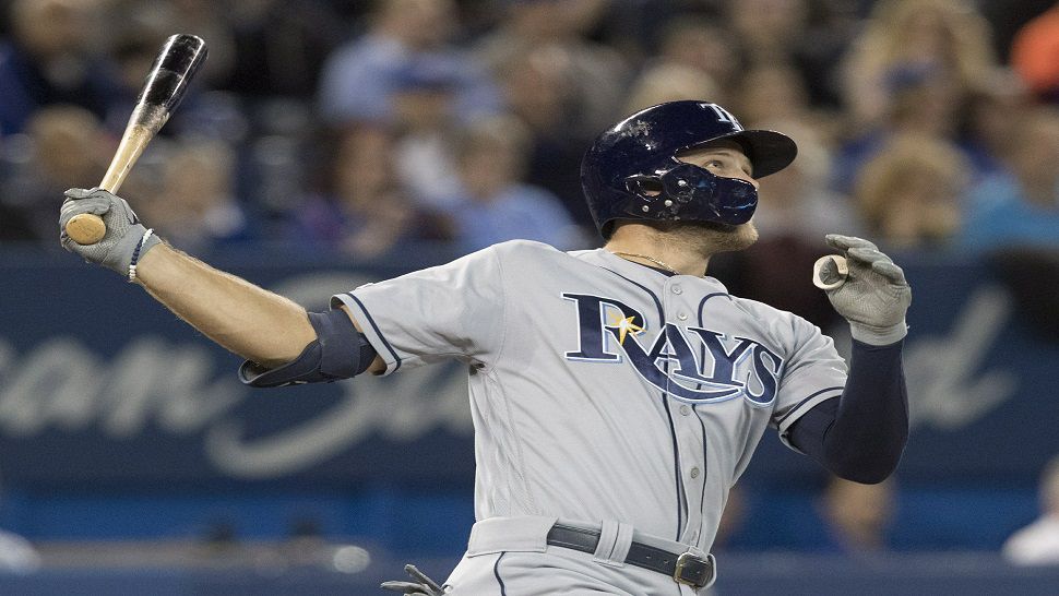 Tampa Bay Rays outfielder Austin Meadows watches his home run reach the upper deck of the Rogers Centre.  Meadows and Brandon Lowe became the first teammates to hit upper-deck home runs at Toronto in the same game.  (Fred Thornhill/The Canadian Press via AP)