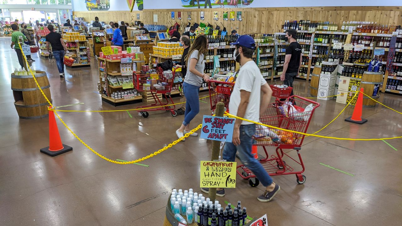 Shoppers at Trader Joe's (AP Photo/Damian Dovarganes)