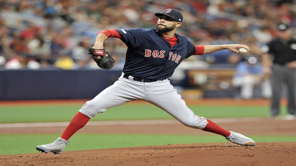 Boston Red Sox starting pitcher David Price pitches against the Tampa Bay Rays in Sunday's series finale.  The former Ray struck out 10 Tampa Bay hitters in five innings.  (AP Photo/Steve Nesius)