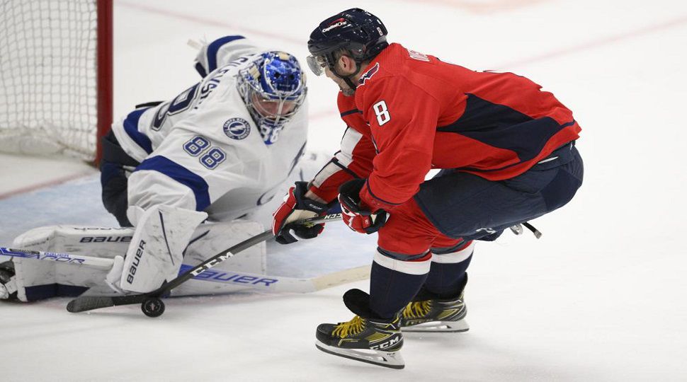 Washington Capitals left wing Alex Ovechkin (8) is stopped by Tampa Bay Lightning goaltender Andrei Vasilevskiy (88) during the third period of an NHL hockey game Wednesday, April 6, 2022, in Washington. The Capitals won 4-3. (AP Photo/Nick Wass)
