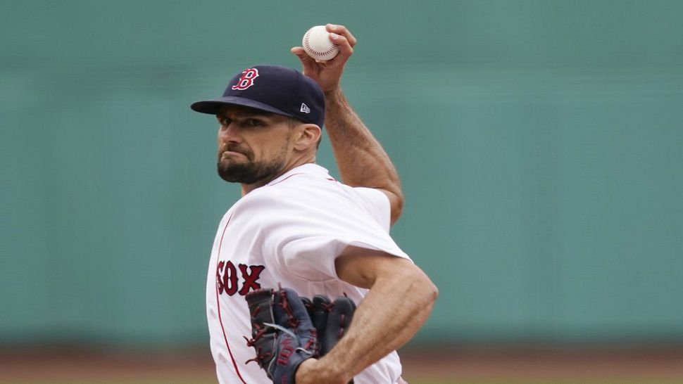 Boston Red Sox starting pitcher Nathan Eovaldi delivers in the first inning of Boston's 9-2 win over Tampa Bay.  The former Rays pitcher pitched seven innings, allowing only one earned run and striking out seven. (AP Photo/Elise Amendola)