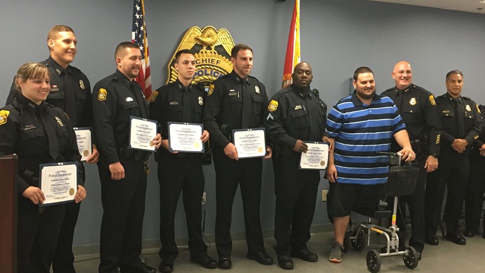 Tampa Police officers gathered for the department's monthly awards ceremony, Wednesday, April 18, 2018. (Dave Jordan, staff)