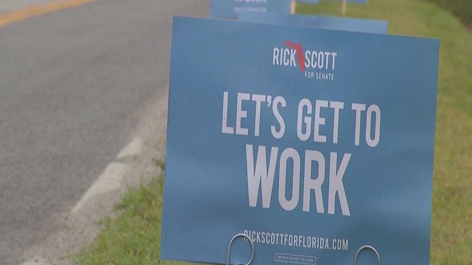 "Rick Scott for Senate" campaign signs