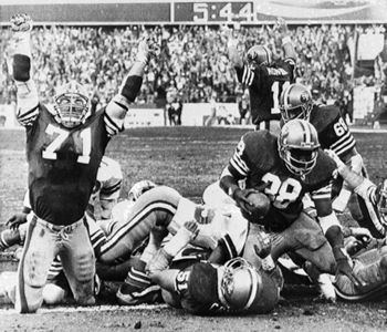 FILE - San Francisco 49ers quarterback Steve Young upends Dallas Cowboys  cornerback Deion Sanders after Sanders intercepted Young in the first  quarter of their Sunday, Nov 2, 1997, game in San Francisco.