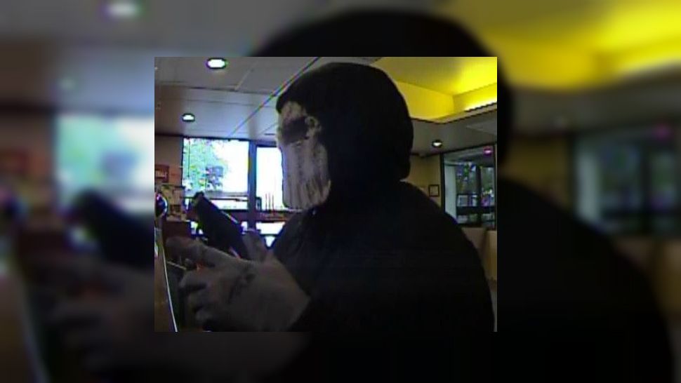 Photograph of suspect in North Austin bank robbery