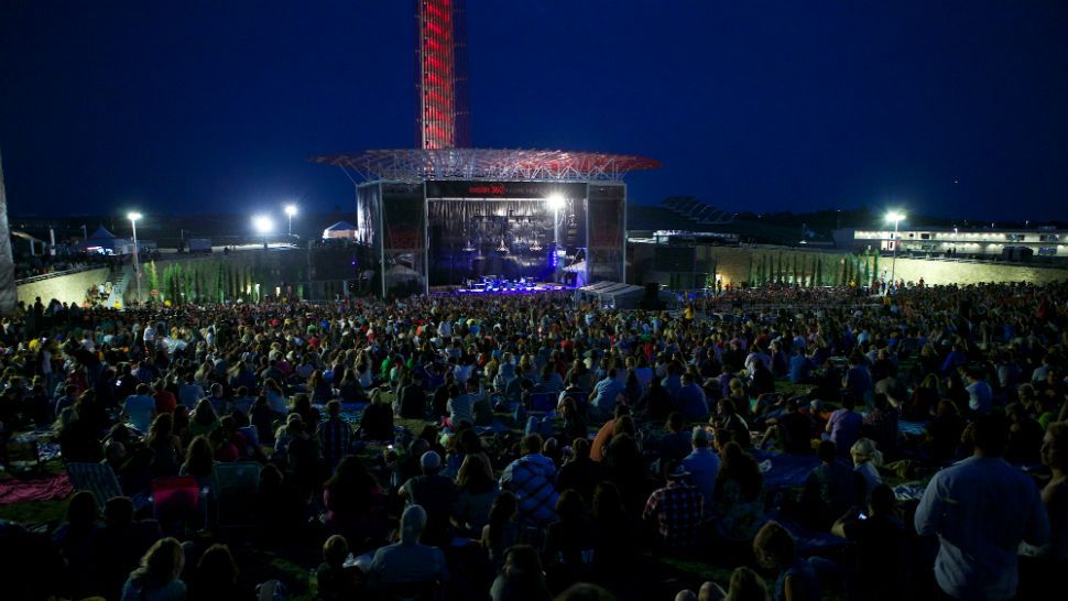 Photo of people gathered at a performance at COTA's amphitheater (photo credit: COTA)