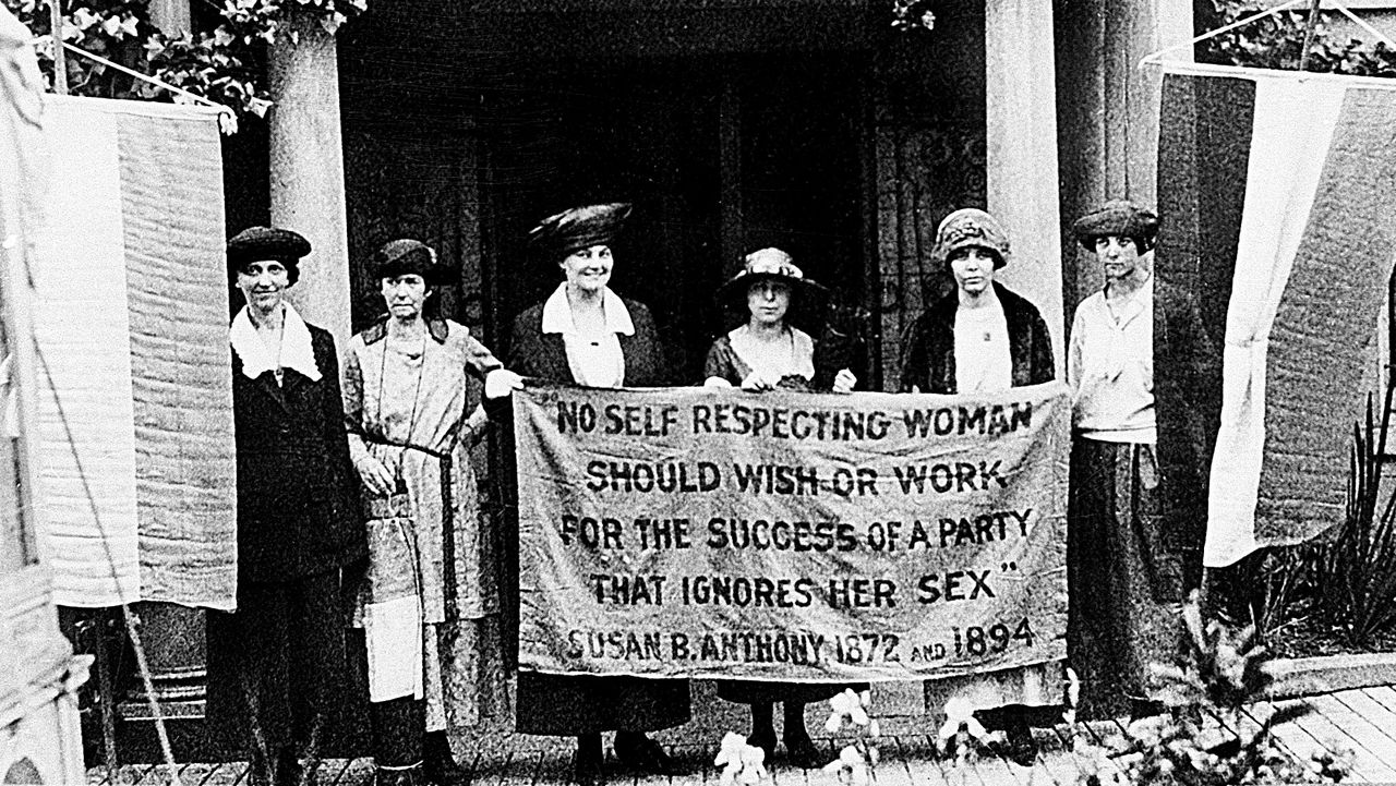 Chairwoman Alice Paul, second from left, and officers of the National Woman's Party hold a banner with a Susan B. Anthony quote in front of the NWP headquarters in Washington, D.C., June 1920. The suffragettes are ready for the G.O.P. convention to seek support for the ratification of the 19th Amendment granting women the right to vote. The other suffragettes are, Sue White, Mrs. Benigna Green Kalb, Mrs. James Rector, Mary Dubrow and Elizabeth Kalb. (AP Photo)