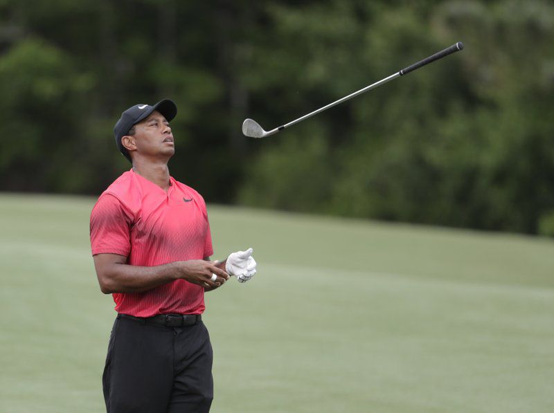 Tiger Woods shows his frustration on the 14th fairway during the fourth round of The Players Championship at TPC Sawgrass. (AP Photo)