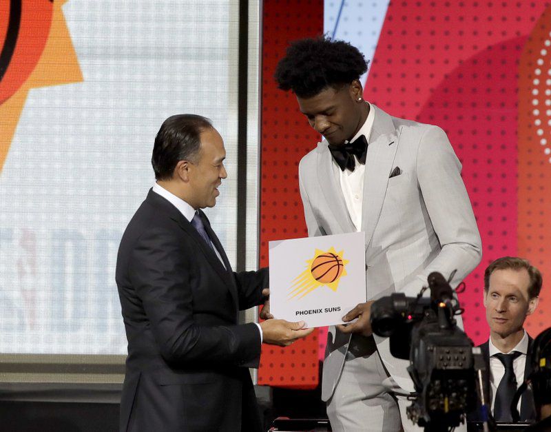 The Phoenix Suns won the 2018 NBA Draft Lottery and will select first overall in June's draft.  Suns forward Josh Jackson represented Phoenix in Chicago.  (AP Photo/Charles Rex Arbogast)