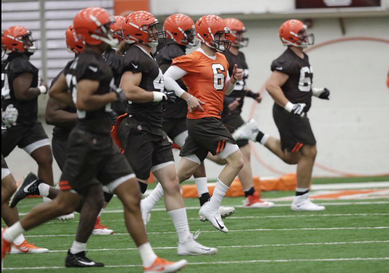 First overall pick Baker Mayfield (6) runs a drill during Browns rookie mini-camp earlier this month.  (AP Photo/Tony Dejak)