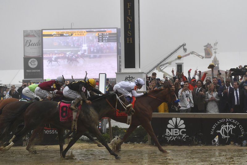Justify, with jockey Mike Smith atop, wins the 143rd Preakness Stakes at Pimlico Race Track in Baltimore, MD.  (AP Photo/Mike Stewart)