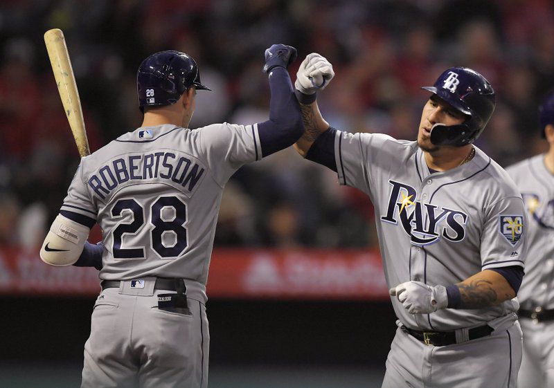 Rays catcher Wilson Ramos is congratulated by Daniel Robertson after hitting a 2-run home run in the Rays 8-3 win over the Angels on Friday. (AP Photo/Mark J. Terrill)