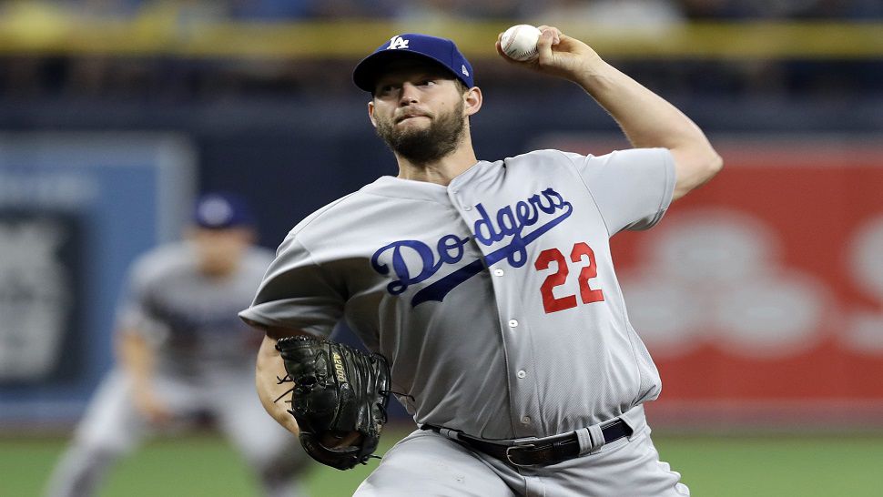 Los Angeles Dodgers ace Clayton Kershaw delivers a pitch in the first inning of L.A.'s 7-3 win over the Rays.  Kershaw struck out eight, including five of the first six outs he recorded.  (AP Photo/Chris O'Meara)