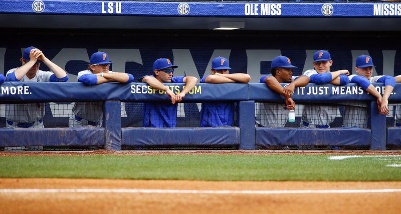 Florida baseball players look on during their SEC tournament loss to LSU.  The Gators will still likely be a top seed in the College World Series, which begins next week.  (AP Photo/Butch Dill)