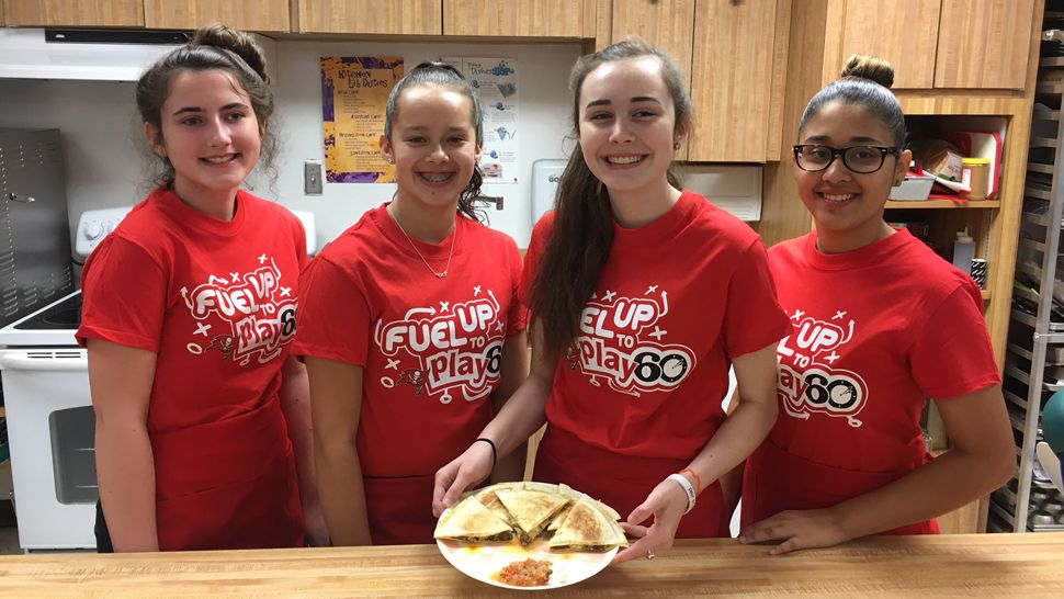 Left to right: Paige Abbott, Kelsey Slone, Taryn Arnett, Jangles Miranda - Lake Gibson Middle School team competing in 2018 Gridiron Cooking Challenge