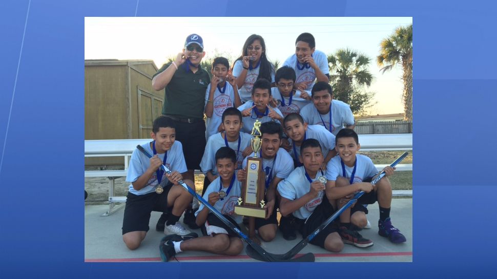 RCMA Leadership Academy hockey team with their championship trophy