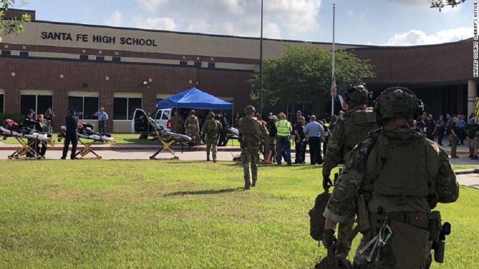 A triage unit attends to patients in front of Santa Fe High School in the Houston area after a shooter killed multiple people, according to officials. (KTRK via CNN)