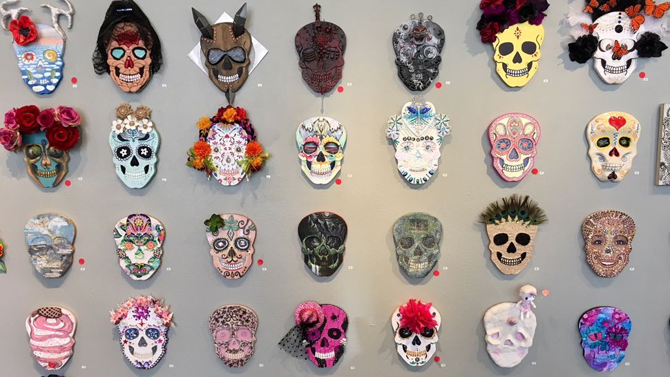 Wall covered with decorated sugar skulls