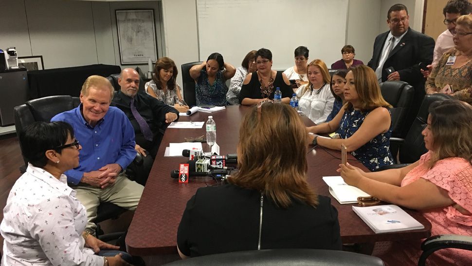 Senator Bill Nelson (left) listens to members of five Puerto Rican families displaced from the island by Hurricane Maria and still living in the Tampa Bay area during a meeting at Tampa Underground, Thursday, May 3, 2018. (Adria Iraheta, staff)