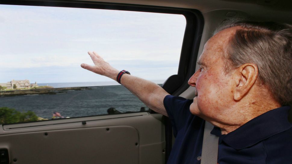 Former president George H.W. Bush waved at a crowd holding American flags as he returned to his family's summer home in Maine on Sunday, May 21. Courtesy/AP