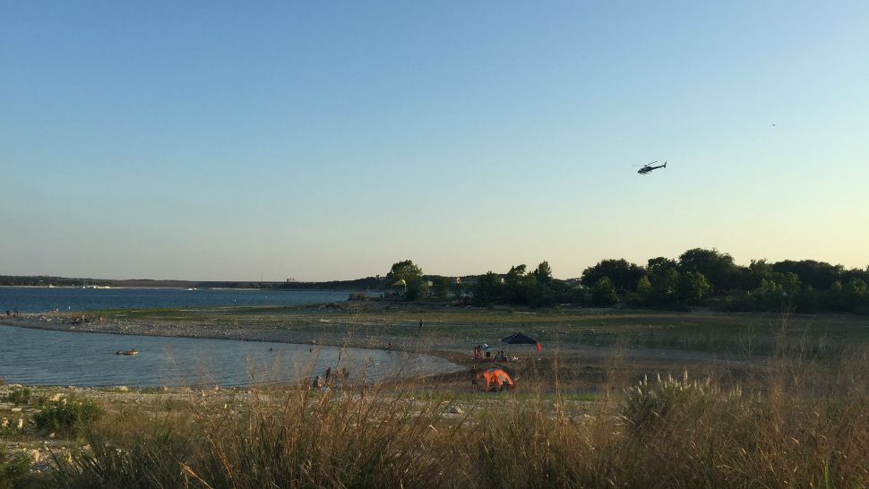 Helicopter searches for missing swimmer (Spectrum News Photograph)