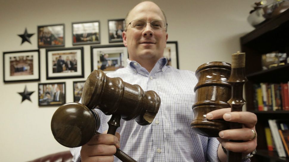 In this June 1, 2015, file photo, then Texas Rep. Kenneth Sheets, R-Dallas, poses with three of the six solid, mahogany gavels he broke during the legislative session in Austin, Texas. Sheets, a Marine and Iraq war veteran, is running to replace Jeb Hensarling from Dallas who is term-limited out of his chairmanship of the House Financial Services Committee. Five Republicans and two Democrats have announced that they'll be leaving office next year, along with the powerful GOP speaker of the Texas House and some of his top lieutenants. (AP Photo/Eric Gay, File)