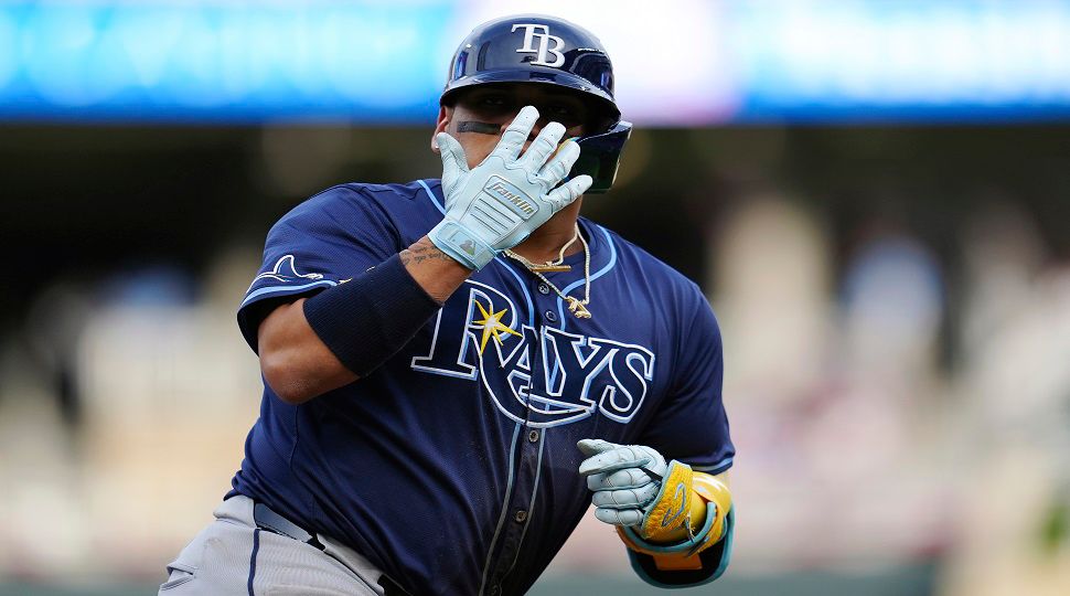 Tampa Bay Rays' Isaac Paredes gestures while running the bases after hitting a solo home run during the third inning of a baseball game against the Minnesota Twins, Wednesday, June 19, 2024, in Minneapolis. (AP Photo/Abbie Parr)