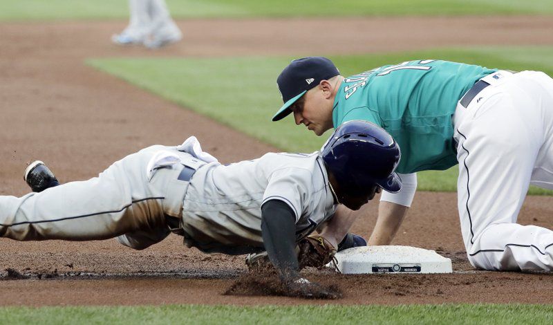 Mallex Smith is caught stealing third in the first inning during the Rays' extra-inning loss Friday night to the Mariners.  (AP Photo/Ted S. Warren)