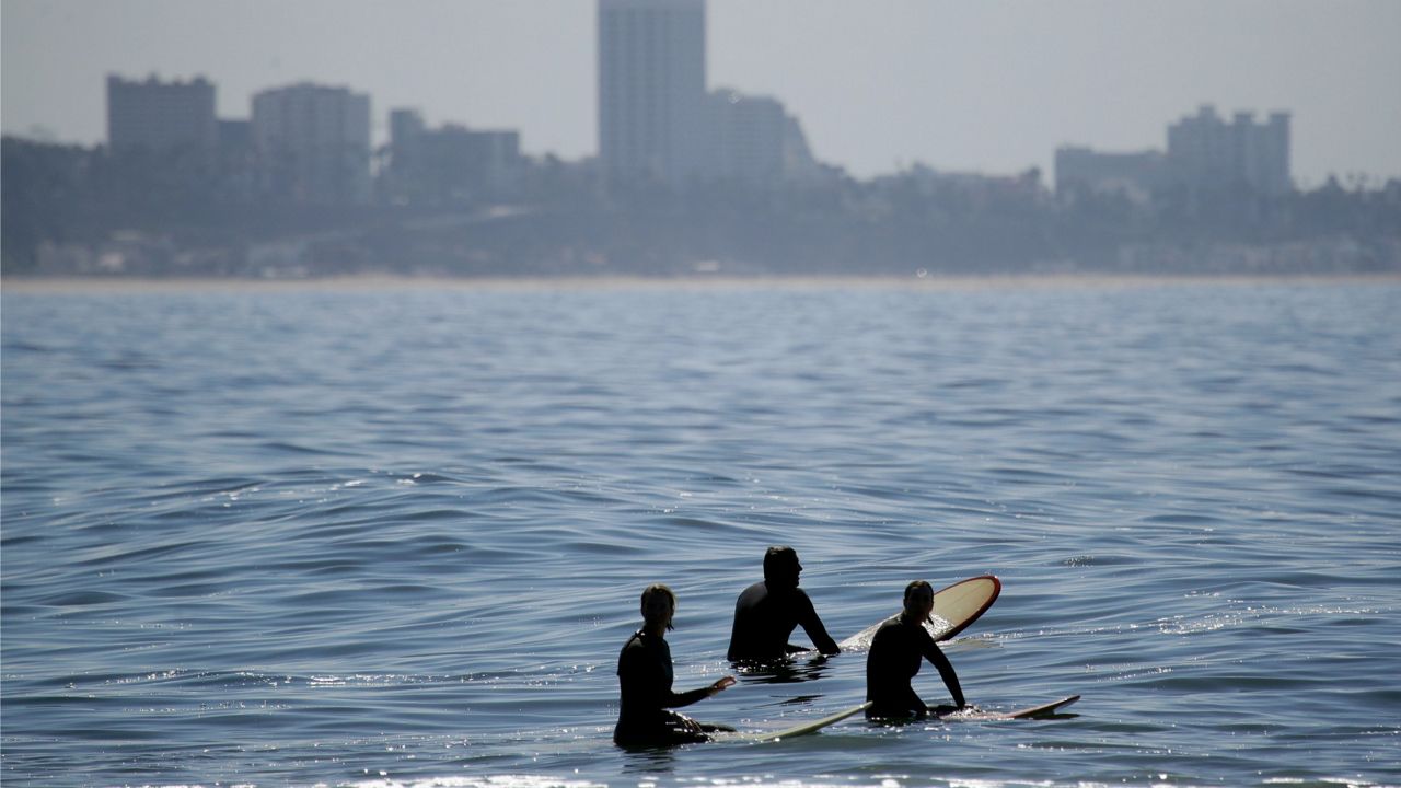 Swimmers enjoyed abnormally warm ocean waters in Southern California in August.