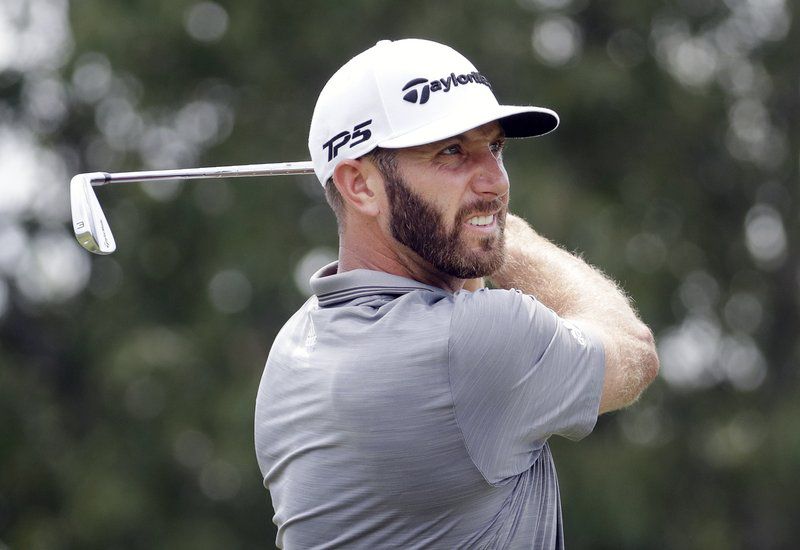 Dustin Johnson watches his drive on the ninth tee during the third round of the St. Jude Classic golf tournament Saturday, June 9, 2018, in Memphis, Tenn. (AP Photo/Mark Humphrey)
