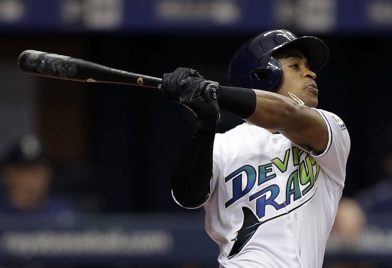 Mallex Smith follows through on his RBI triple off Mariners starting pitcher Felix Hernandez during the third inning of the Rays' 7-3 win over Seattle. (AP Photo/Chris O’Meara)