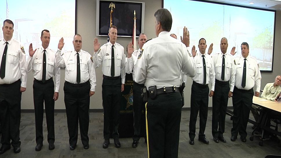 Hernando County Sheriff Al Nienhuis swears in 9 new deputies, all former members of the now-disbanded Brooksville Police Department, on Friday. (Kim Leoffler, staff)