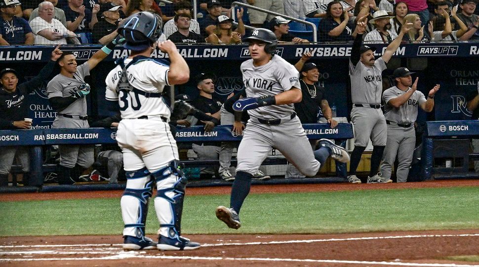 Tampa Bay Rays catcher Ben Rortvedt (30) looks on as New York Yankees' Anthony Volpe scores on Trent Grisham's RBI double during the second inning of a baseball game Wednesday, July 10, 2024, in St. Petersburg, Fla. (AP Photo/Steve Nesius)