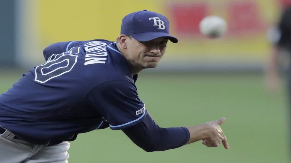 Charlie Morton delivers a pitch during the third inning of Tampa Bay's 12-4 win over the Orioles in the night cap of Saturday's doubleheader.  The right-handed pitcher picked up his 11th win of the season.  (AP Photo/Julio Cortez)