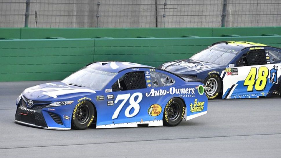 Martin Truex Jr. became the first repeat winner at Kentucky Speedway, dominating the race by leading 174 of the 267 laps.  (AP Photo/Timothy D. Easley)