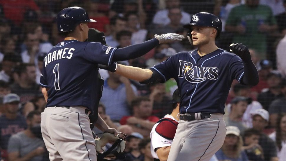 Austin Meadows (right) is congratulated by Willy Adames (1) after his three-run home run in the second inning that opened up a 5-run Rays lead.  Tampa Bay held off a Boston rally for an 8-5 victory.  (AP Photo/Charles Krupa)