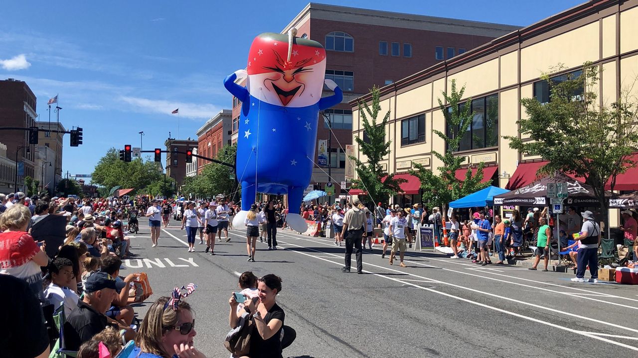 A giant helium balloon makes its way down North Street during Pittsfield's Fourth of July parade Monday morning.
