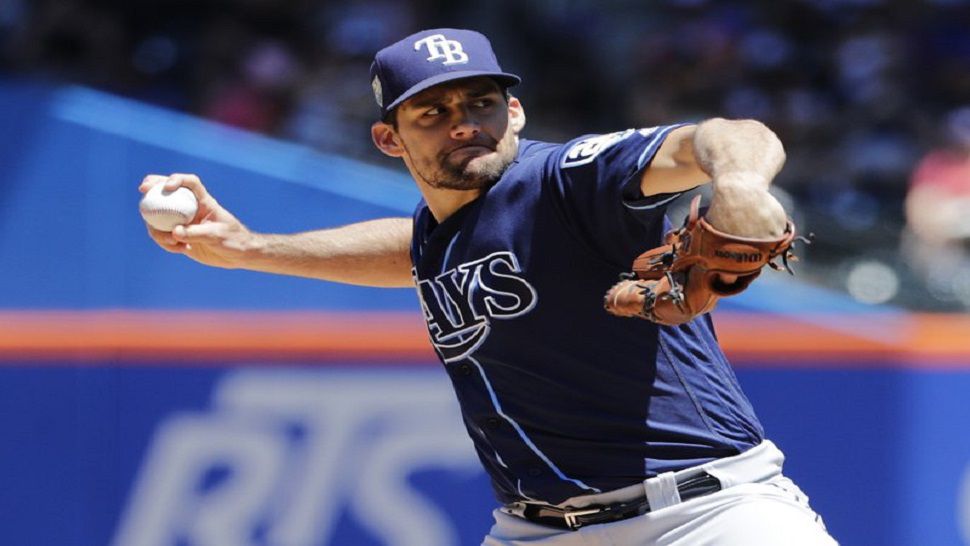 Nathan Eovaldi delivers a pitch during the first inning of the Rays' 9-0 win over the Mets.  The right-hander had a perfect game through six innings and struck out nine in 7 innings.  (AP Photo/Frank Franklin II)