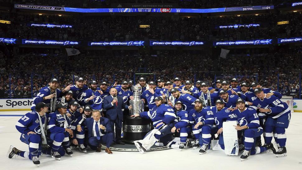 The Tampa Bay Lightning pose with the Stanley Cup after defeating the Montreal Canadiens 1-0 in Game 5 to win the Stanley Cup Final. They are just the second franchise to win back-to-back titles since the NHL instituted a salary cap. (Bruce Bennett/Pool Photo via AP)