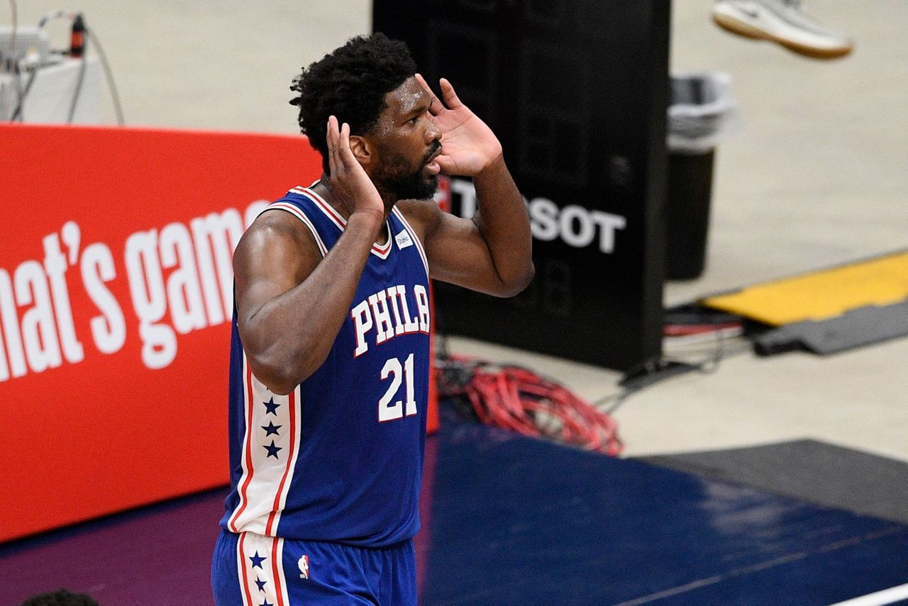 Philadelphia 76ers' Ben Simmons (25) reacts after dunking the ball