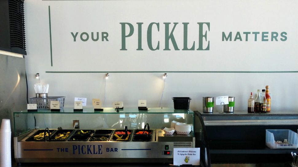 A pickle bar sits below a wall that reads: "YOUR PICKLE MATTERS"