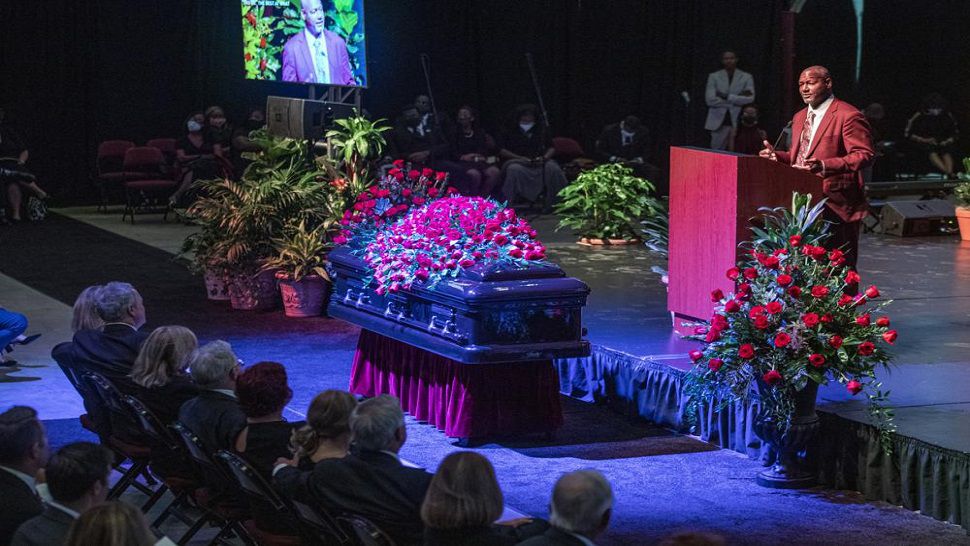 Derrick Brooks, an All American linebacker for Florida State and 11-time Pro Bowler for the Tampa Bay Buccaneers, eulogizes longtime Florida State University football coach Bobby Bowden as he lies in repose at the Tucker Civic Center, during a public celebration of life Saturday. Bowden became the FSU football coach in 1976, transforming the program into one of the best in the country. He coached FSU to national championships in 1993 and 1999. Bowden was 91. (AP Photo/Mark Wallheiser)